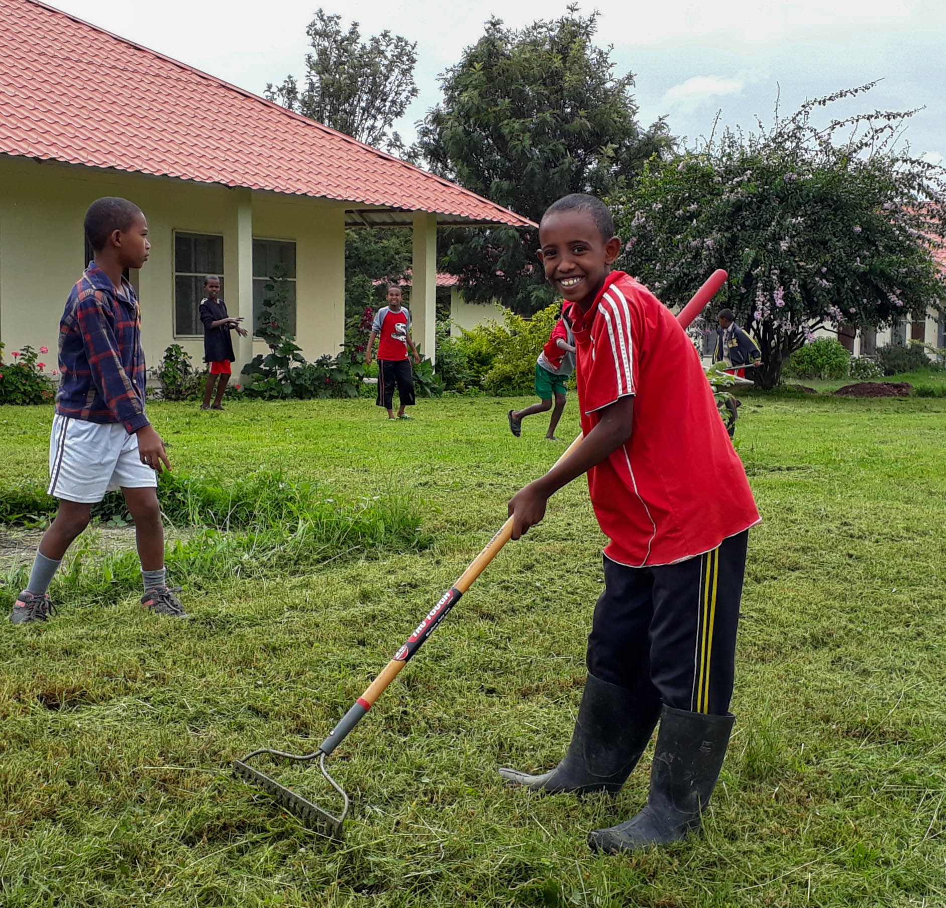 Zerubabel and boys working at the Rafiki classical Christian school