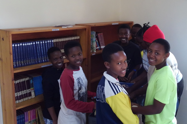 Junior secondary students in Rwanda enjoy their library